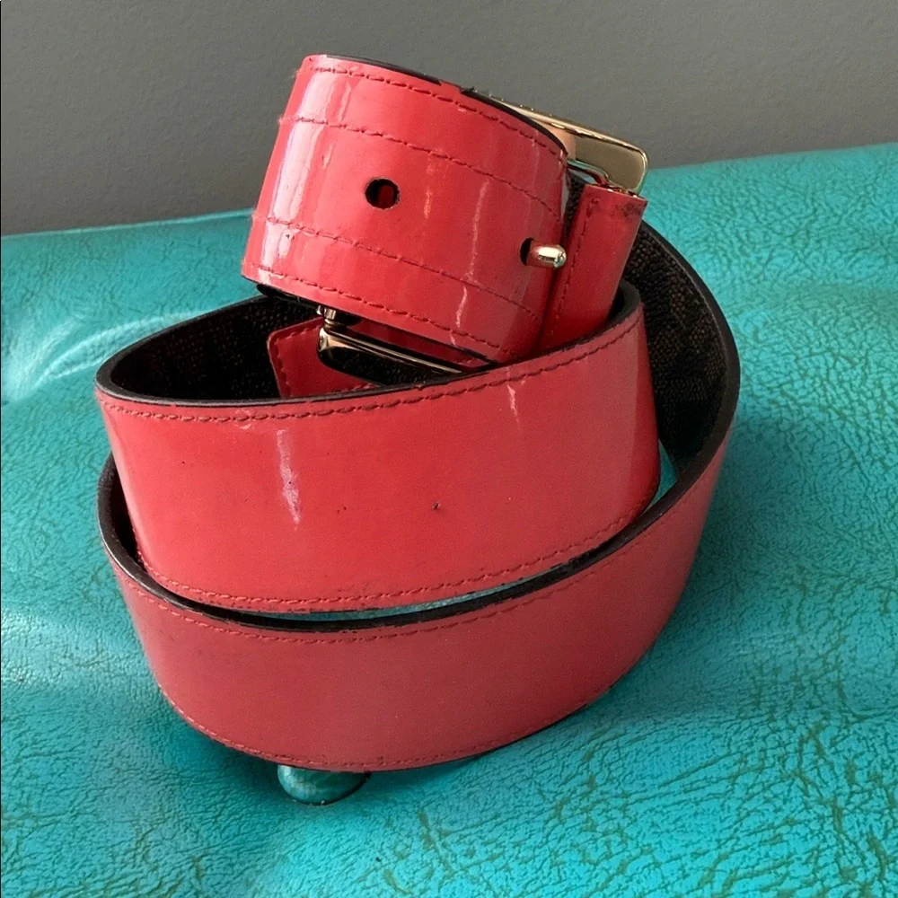 Reversible Michael Kors MK logo belt with bright shiny coral side - see flaw